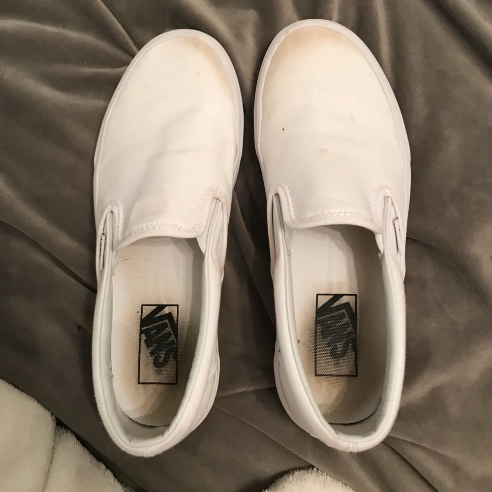 All white slip on vans